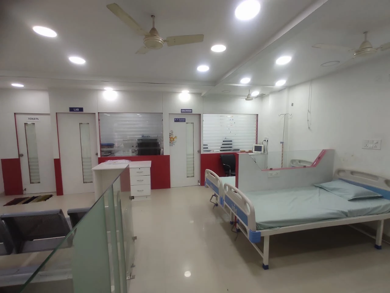 Happy children and pediatric doctors inside a modern children's clinic