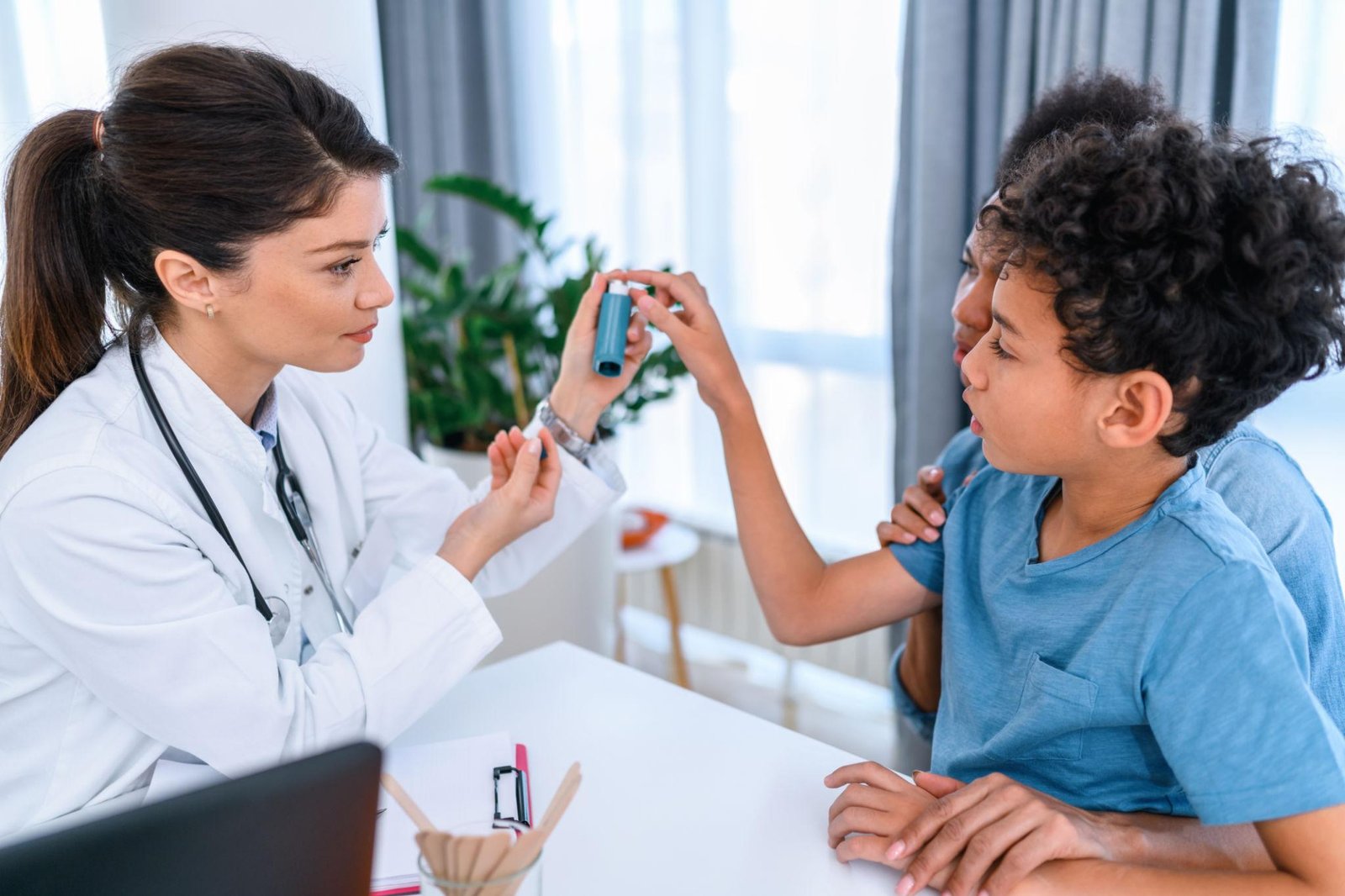 Pediatrician examining a child with asthma symptoms at Juniors Children's Clinic in Beeramguda